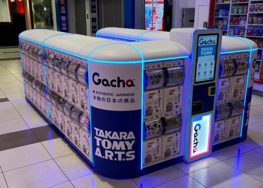 Close-up of Tomy Takara gacha capsule machines in the Northland kiosk